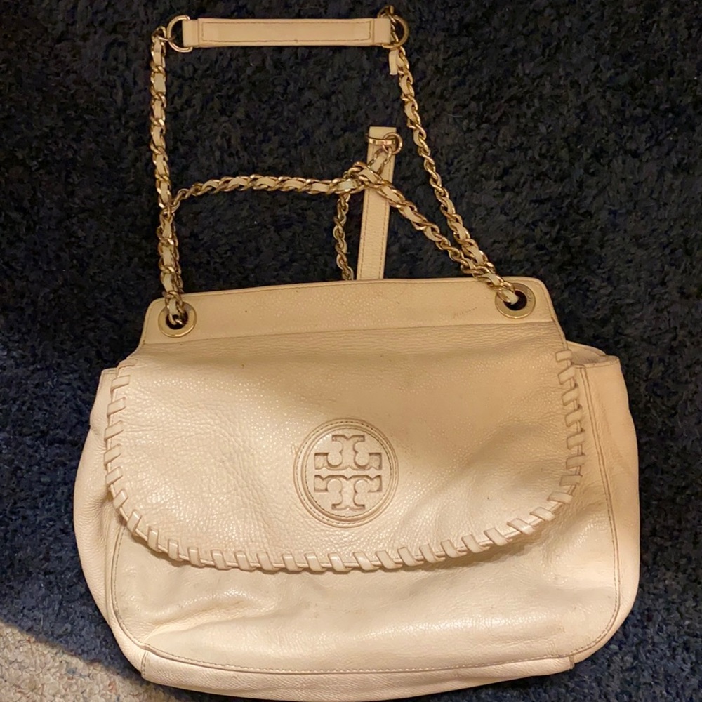 Tory purse. A little wear inside but can be cleaned. Nothing permanent